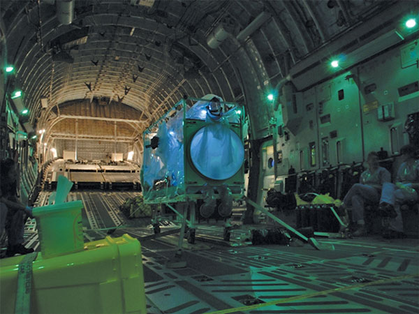 A single Trexler Air Transportable Isolator patient transport system ready for use on a Lockheed Martin C-130 transport aircraft.