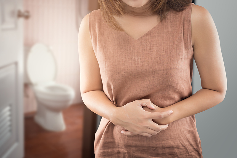 Woman holding stomach
