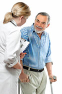 man on crutches talks to doctor