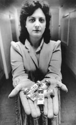 Thumbnail of Sandy Ford with vials of pentamidine for distribution to patients with Pneumocystis pneumonia.