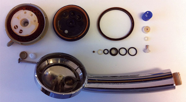 Dismantled showerhead from non-passenger merchant vessel showing multiple inner parts, including 7 O-rings, all of which were in contact with water passing through shower, Australia, 2015.