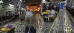 Thumbnail of Demarcation of clean and dirty zones during use of the Trexler Air Transportable Isolator patient transport system on a Boeing C-17 Globemaster transport aircraft. A) Yellow lines clearly demarcate clean and dirty zones as required for transporting both confirmed and exposed viral hemorrhagic fever case-patients. B) For exposed patients, the demarcation zone should extend to a corridor leading to isolated toileting and comfort facilities.