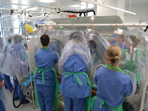 Isolator–isolator transfer is the safest means of transfer for patients with serious infectious diseases and requires practice in dedicated training exercises, as shown.