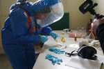 Environmental sampling of a mission team member during the 2020 and 2022 capstone exercises to strengthen international investigations of alleged biological weapons use. Photograph taken by Bernd Bruckmoser. 