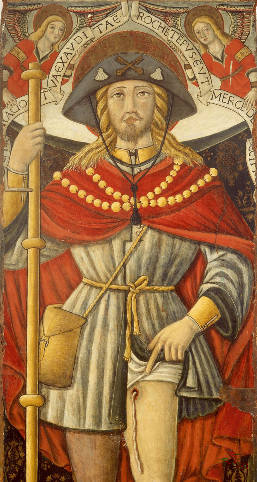 An image of Saint Roch, a French pilgrim and plague saint from the 14th Century, by an unknown painter (ca. 15th–16th Century). The painting shows what is likely a Guinea worm emerging from his leg. Source: Wikimedia Commons.