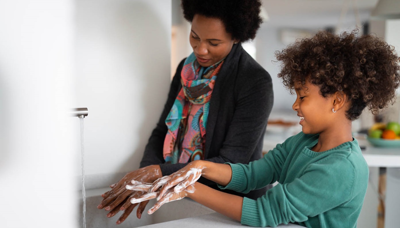 mother and child washing their hands