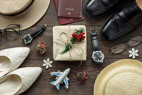 holiday travel collage showing shoes, passport, airplane