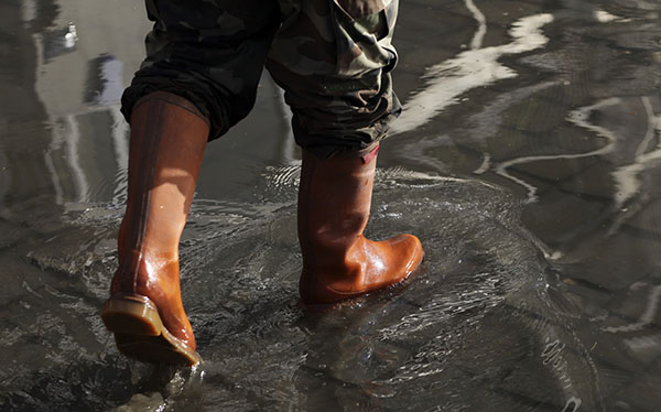 rain boots in water